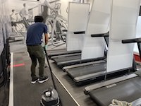 man cleaning the gym